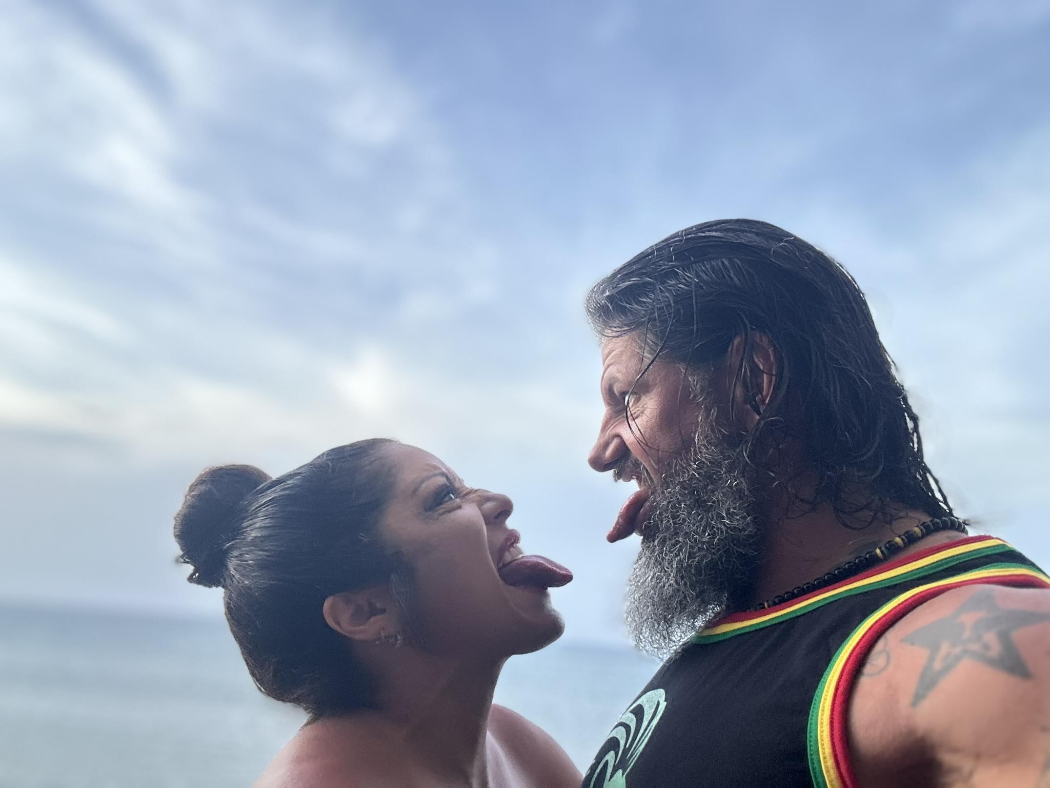 Jimmy and Aimee making goofy faces in the sun